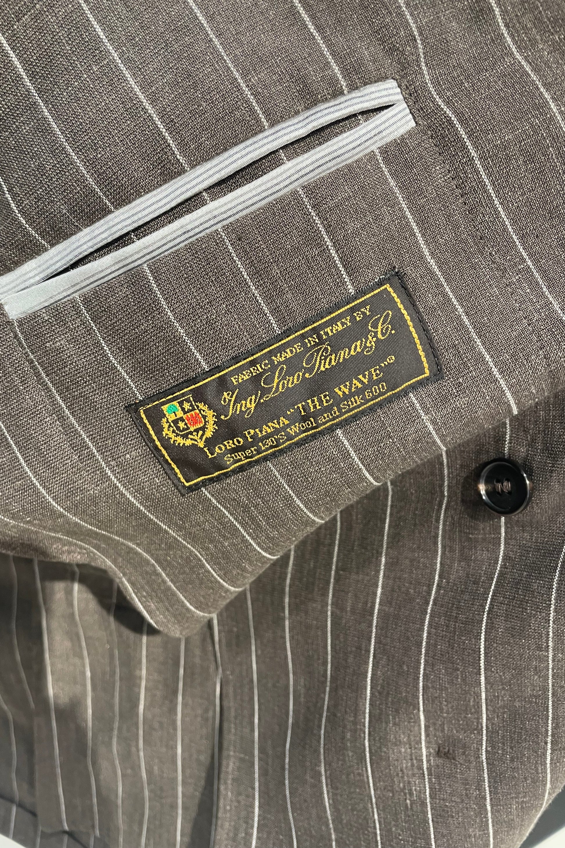 Double-breasted pinstripe suit - Loro Piana® fabrics - MONTEZEMOLO